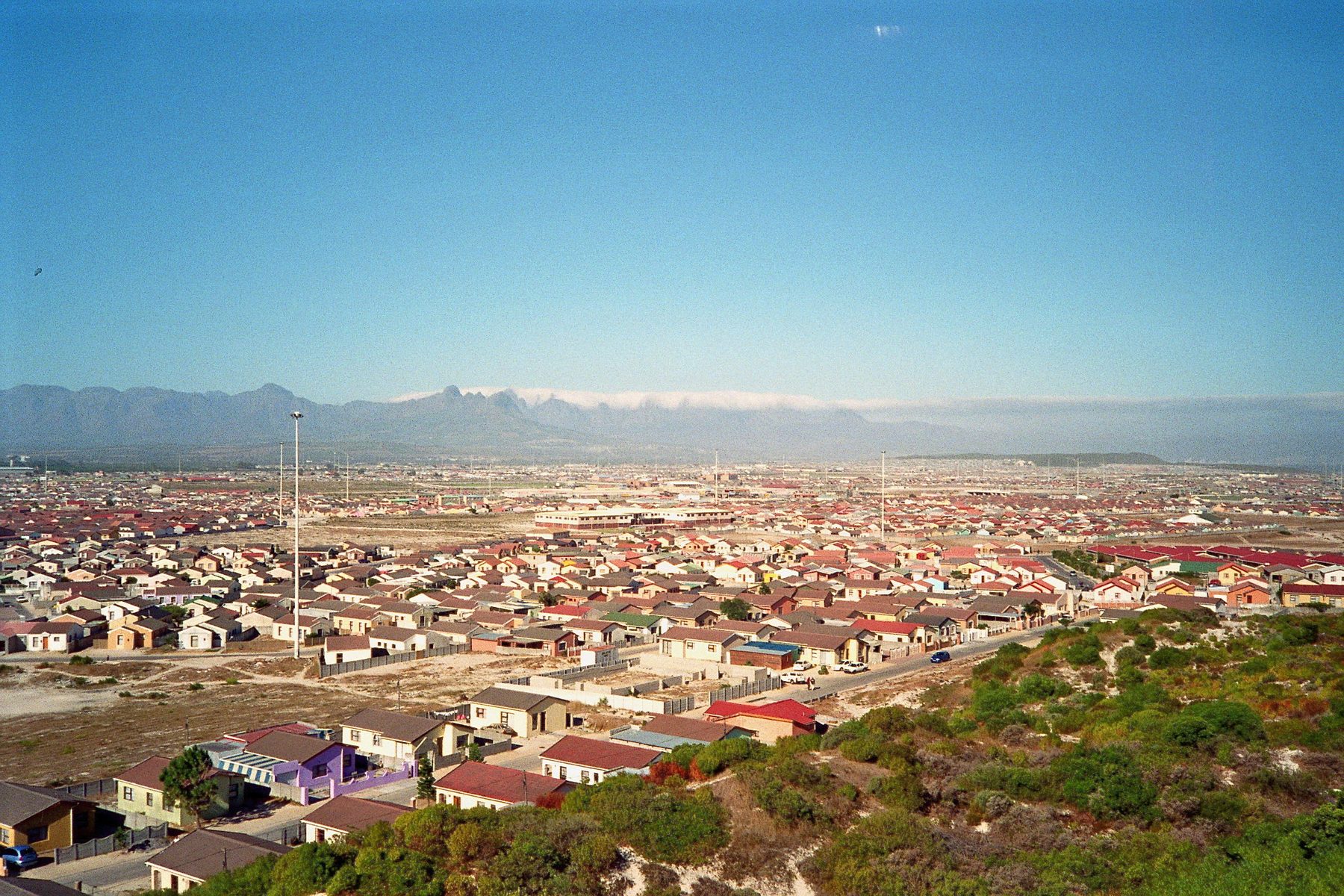 Makhaza, Khayelitsha — rows of homes stretching towards the mountains of the Cape